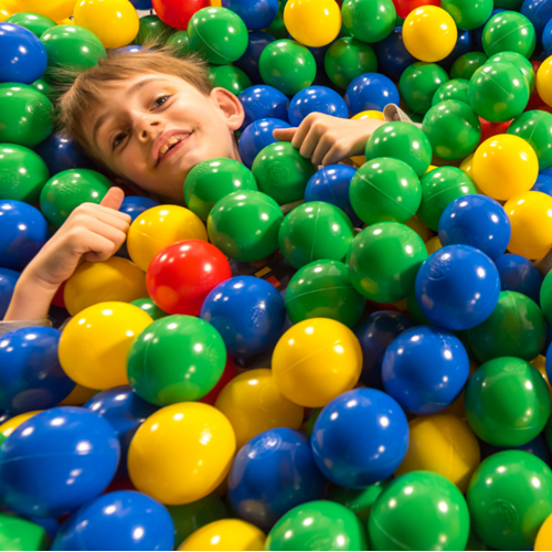 Children playing in a ball pool at Leo's Funzone