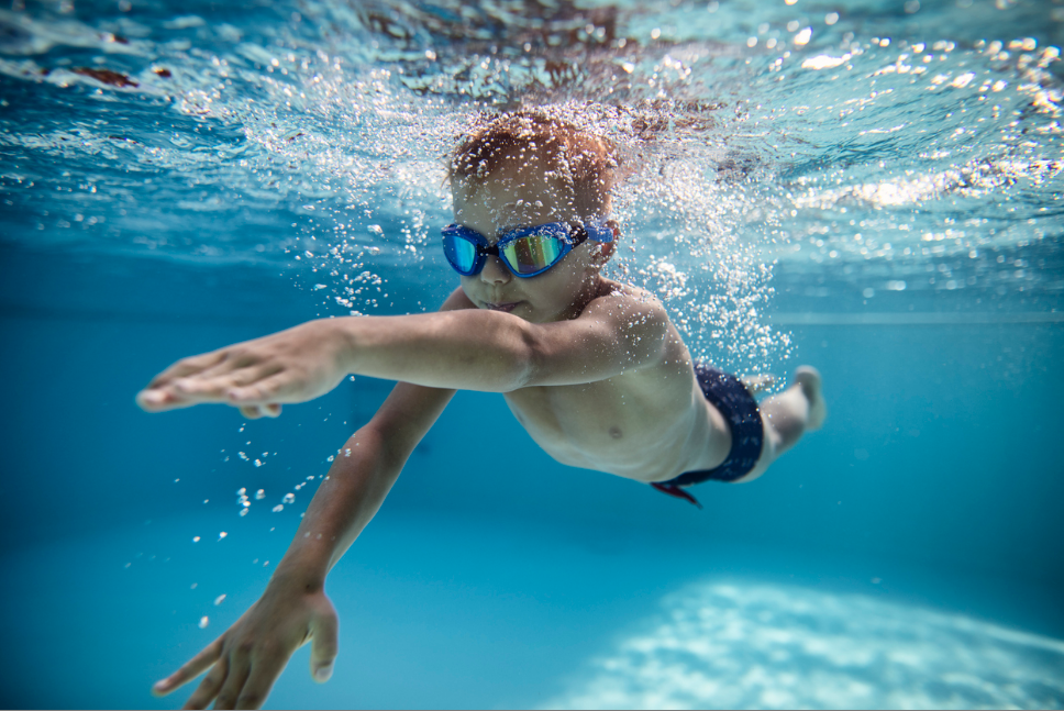 boy swimming underwater